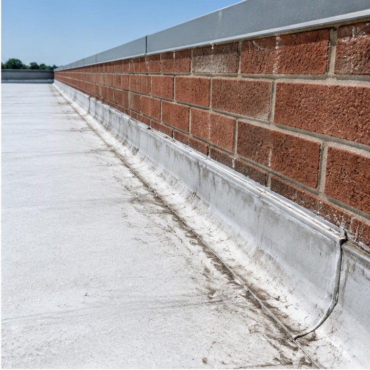 Roof membrane at a commercial brick parapet