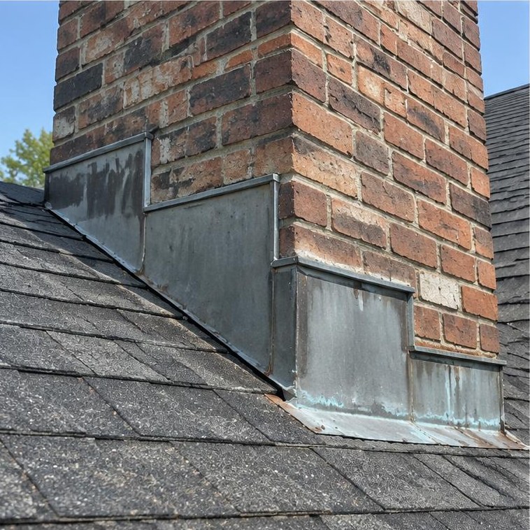 Brick chimney flashing junction