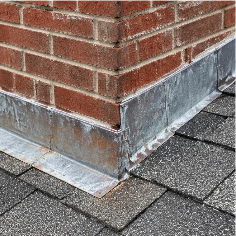Flashing where a roof meets a brick chimney